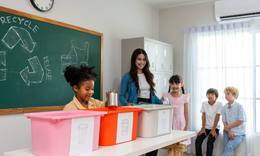 Group of student learn with teacher in classroom at elementary school. Attractive beautiful female instructor master explain and educate young children with happiness and fun activity at kindergarten.